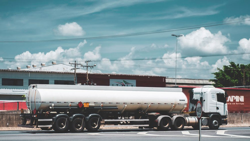 deployment delivery truck at a gas station