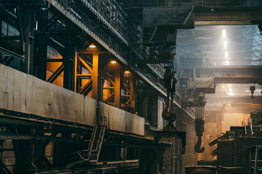 Wide-angle image of refinery with industrial machinery