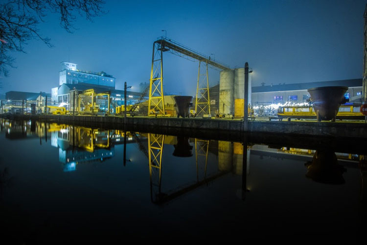 power plant on the water at night