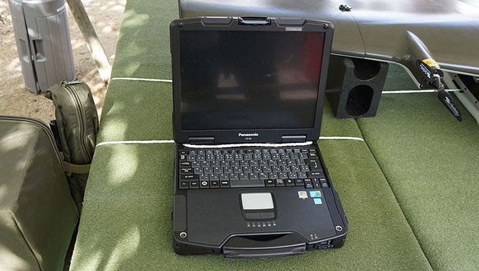 toughbook cf-30 set up on a green table